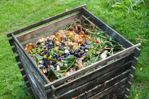 Workers handling segregated commercial waste bins