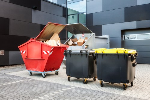 Permit paperwork and labelled recycling bins for a commercial clearance